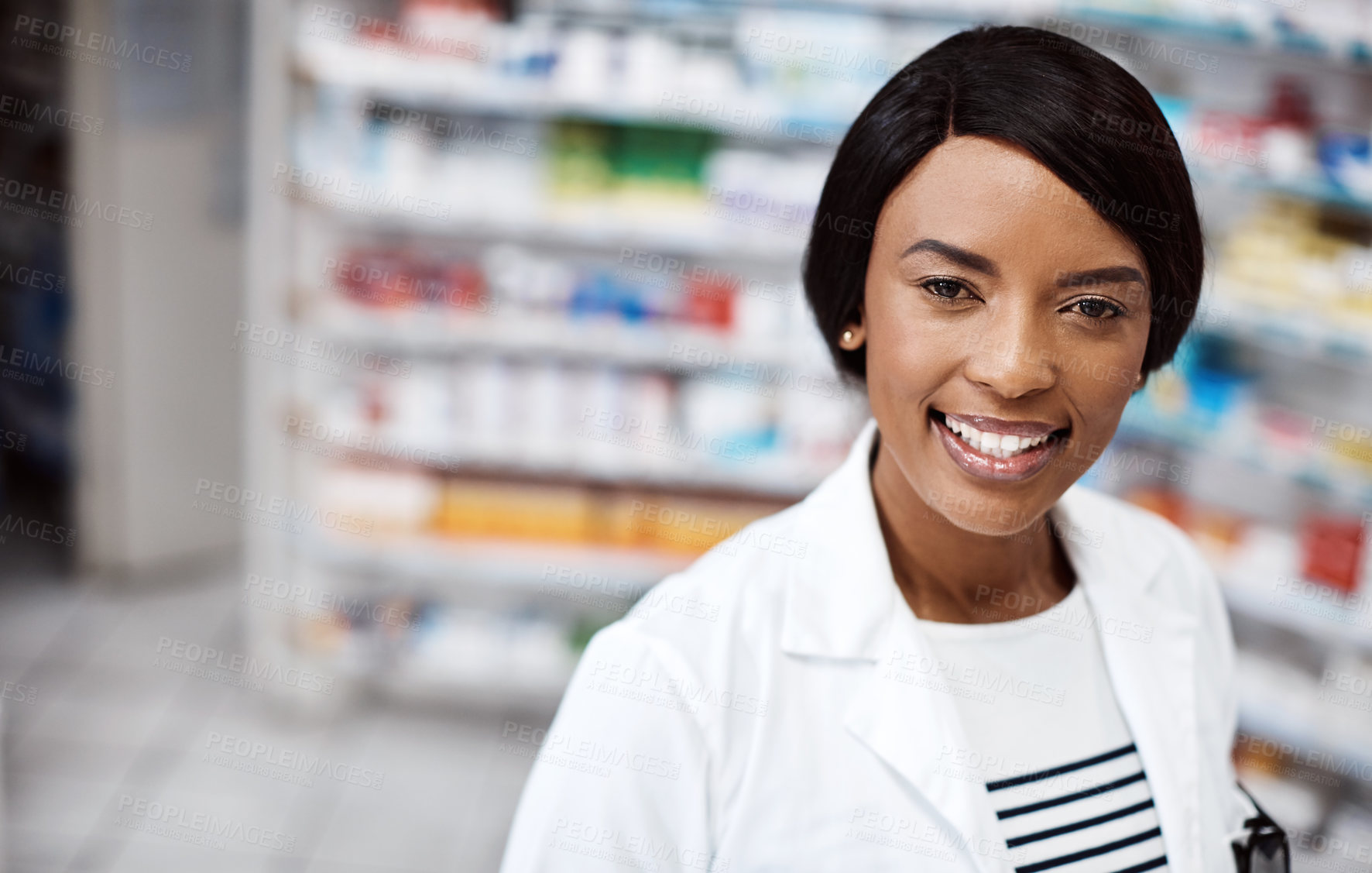 Buy stock photo Shot of a female pharmacist working in a drugstore