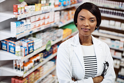 Buy stock photo Shot of a female pharmacist working in a drugstore