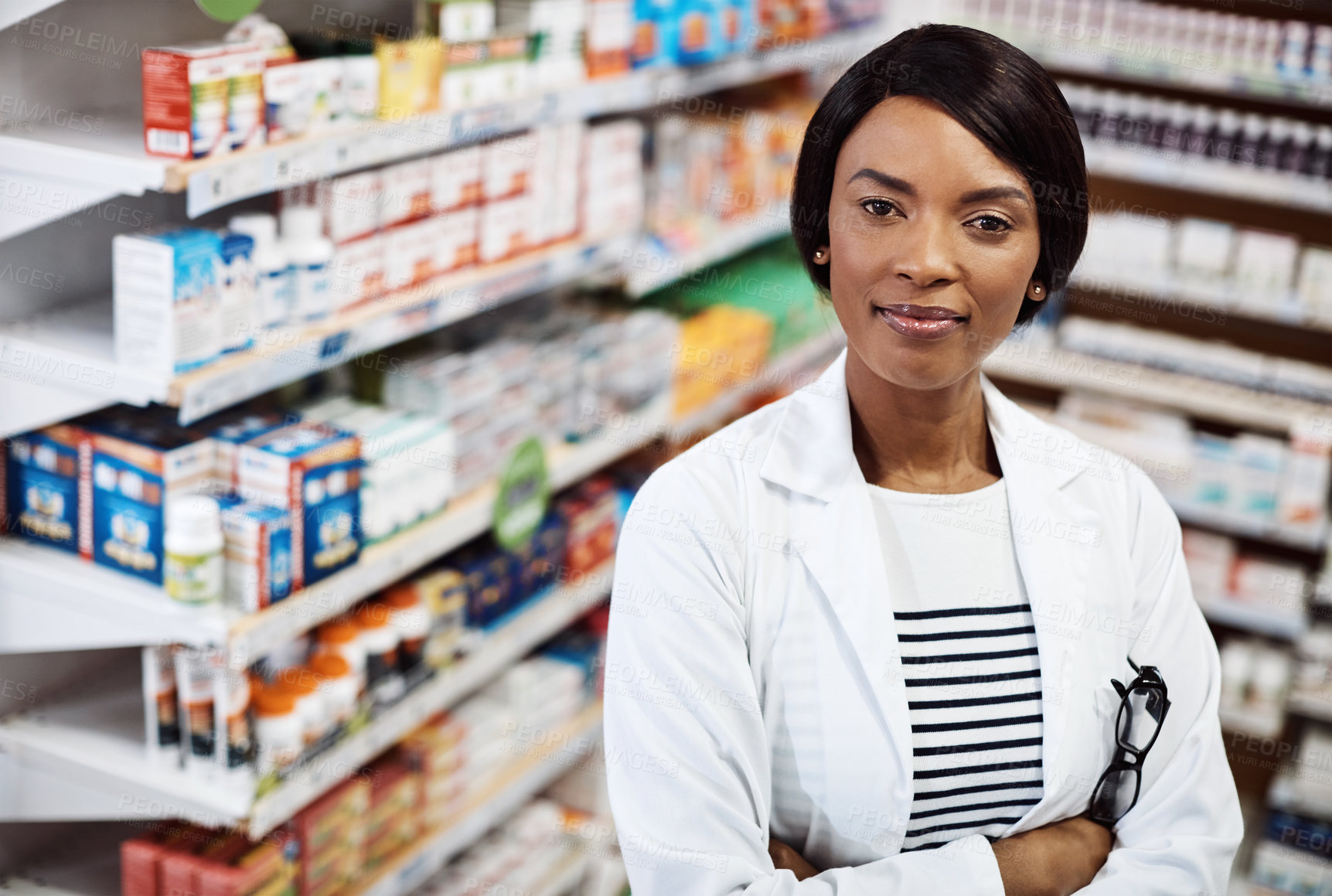 Buy stock photo Shot of a female pharmacist working in a drugstore