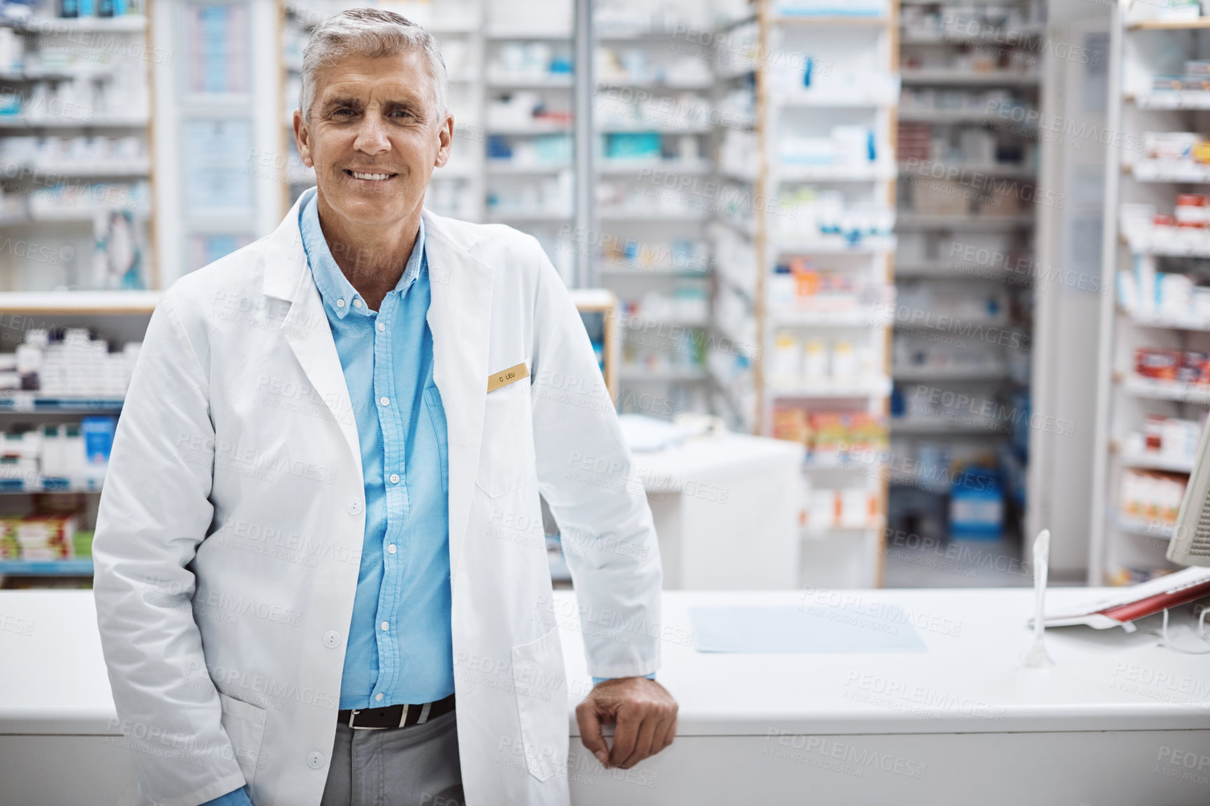 Buy stock photo Shot of a pharmacist working in a drugstore