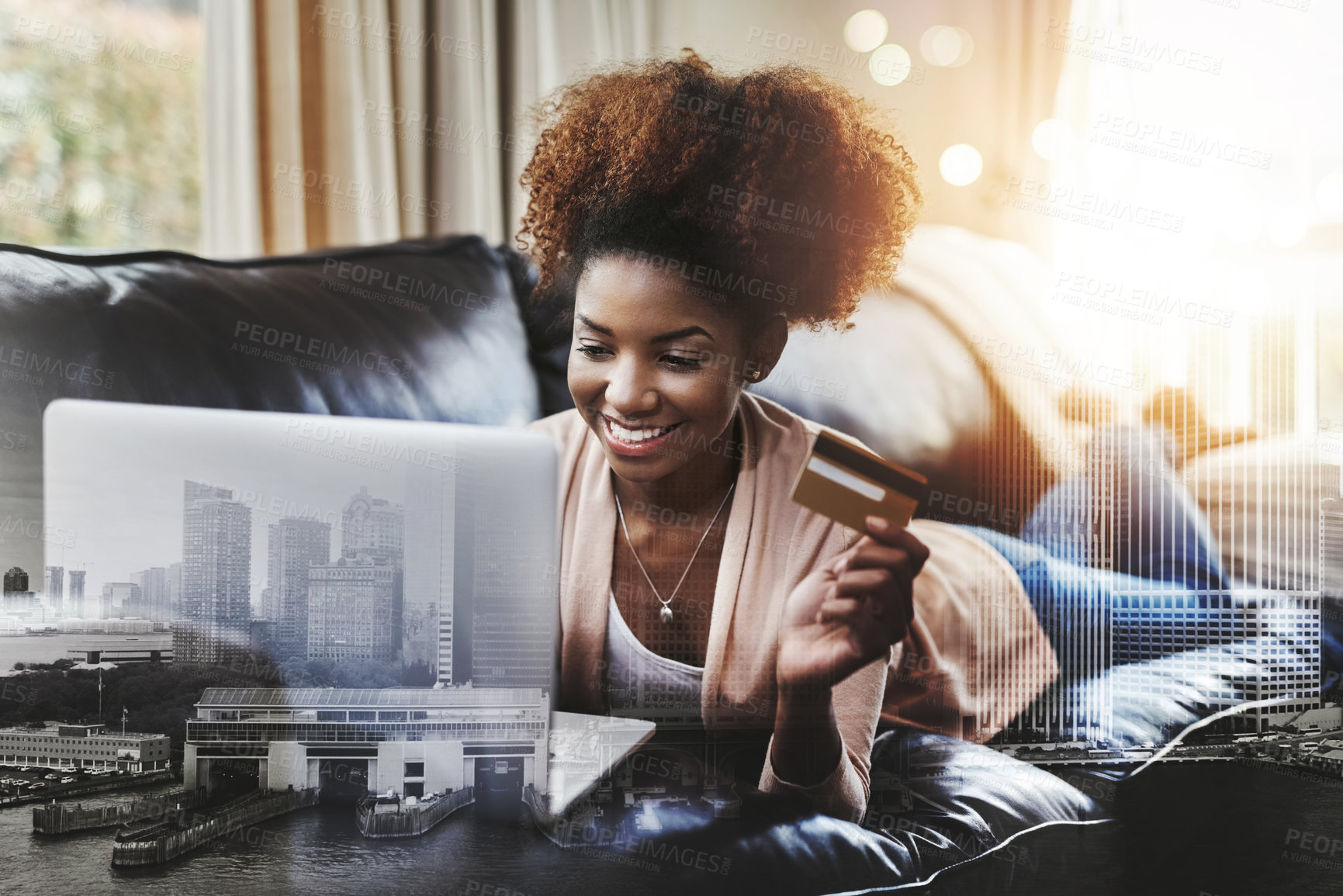 Buy stock photo Sho of an attractive young woman shopping online while chilling at home on the sofa