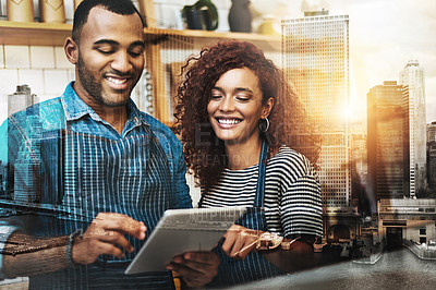 Buy stock photo Cropped shot of an affectionate young couple working on a tablet in their coffee shop