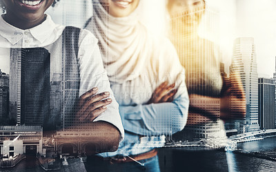 Buy stock photo Shot of a group of confident young businesswomen standing with their arms folded inside of the office at work