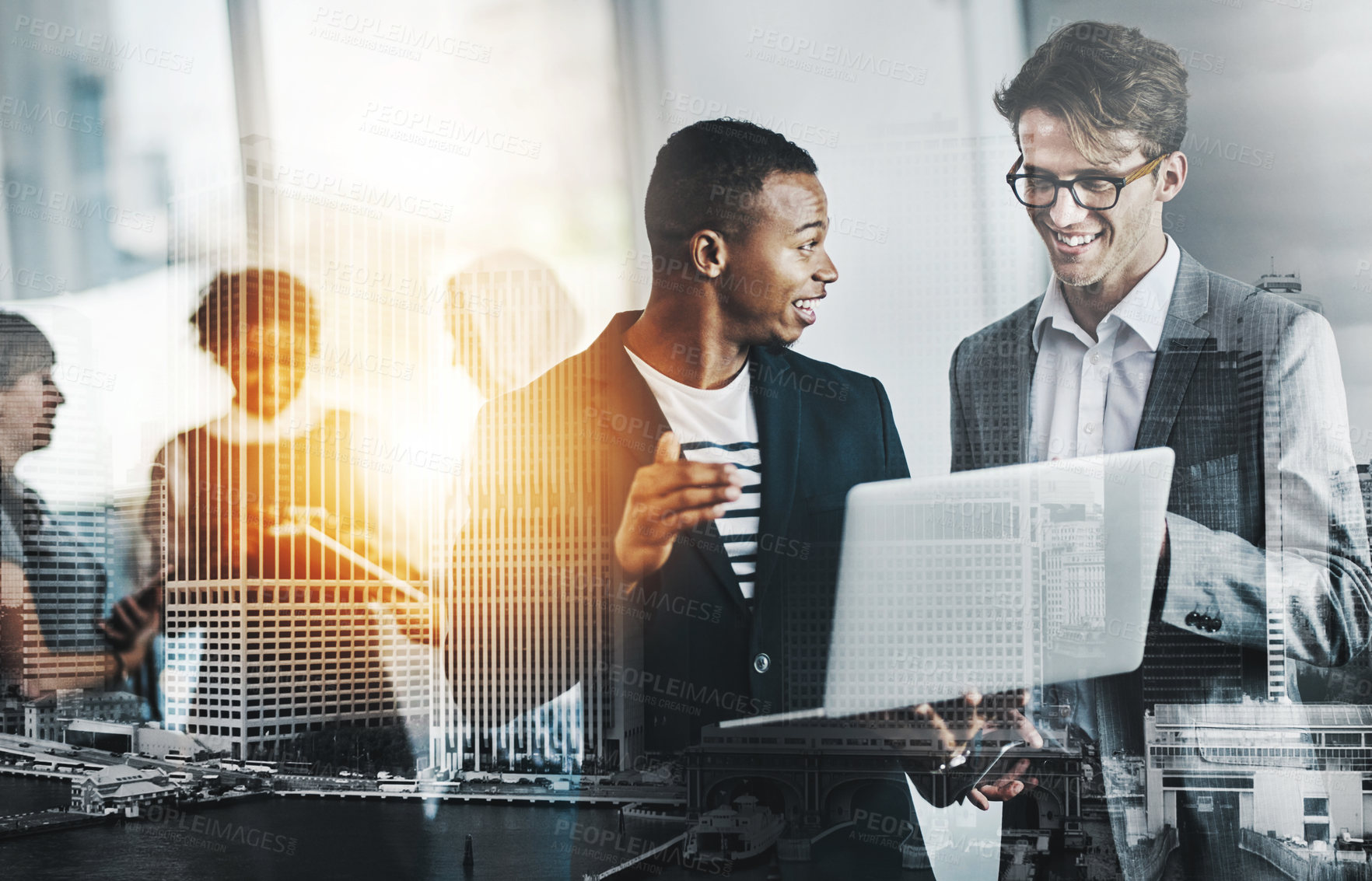 Buy stock photo Shot of a group of young cheerful businesspeople browsing on digital devices while working together in the office at work