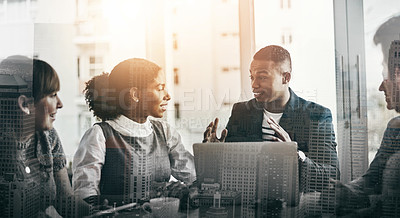 Buy stock photo Cropped shot of a handsome young businessman addressing his colleagues during a meeting in the boardroom