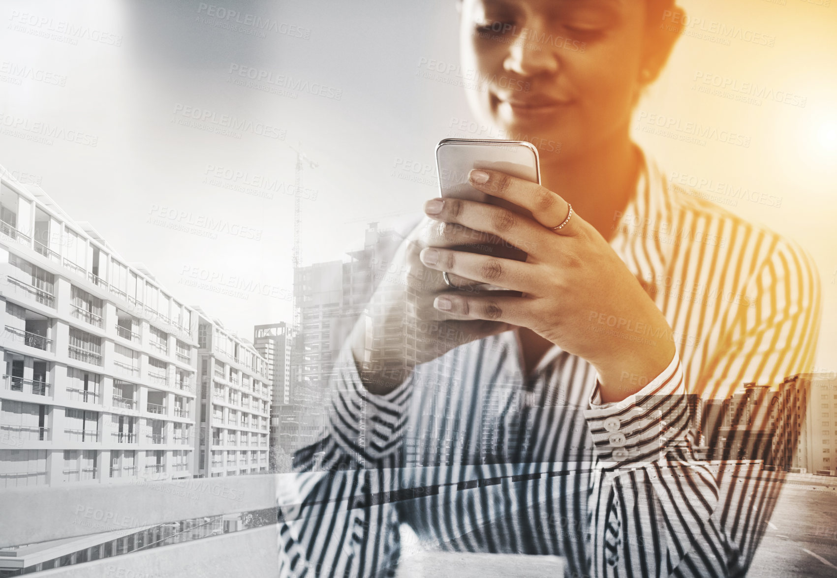 Buy stock photo Shot of a young businesswoman using a cellphone in an office