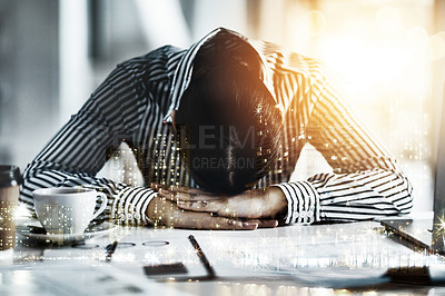 Buy stock photo Shot of a young businesswoman lying with her head down on a desk in an office