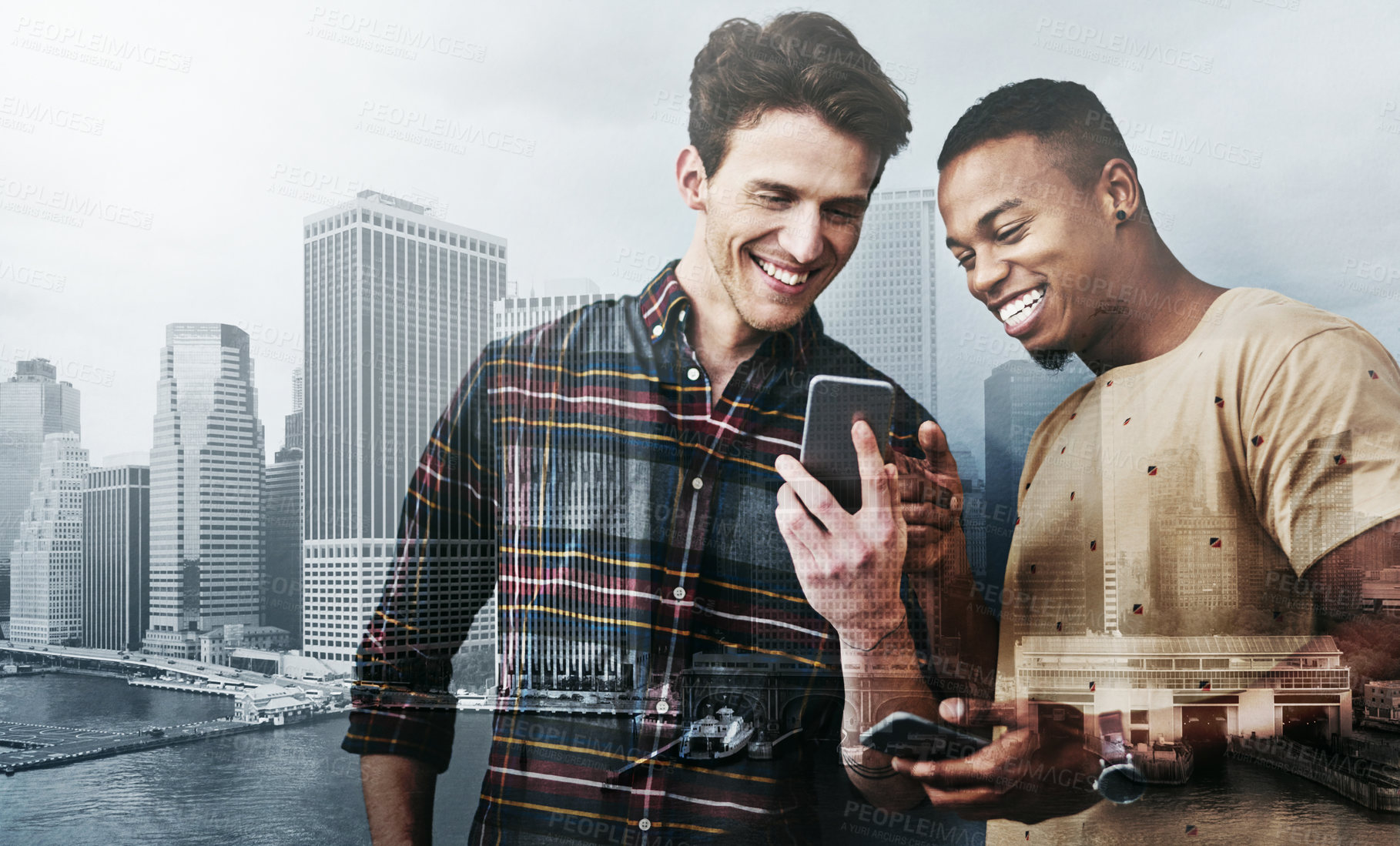 Buy stock photo Studio shot of two young men using a mobile phone together against a gray background