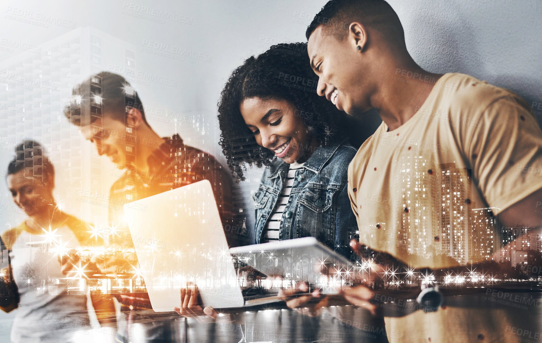 Buy stock photo Studio shot of a group of young people using wireless technology against a gray background