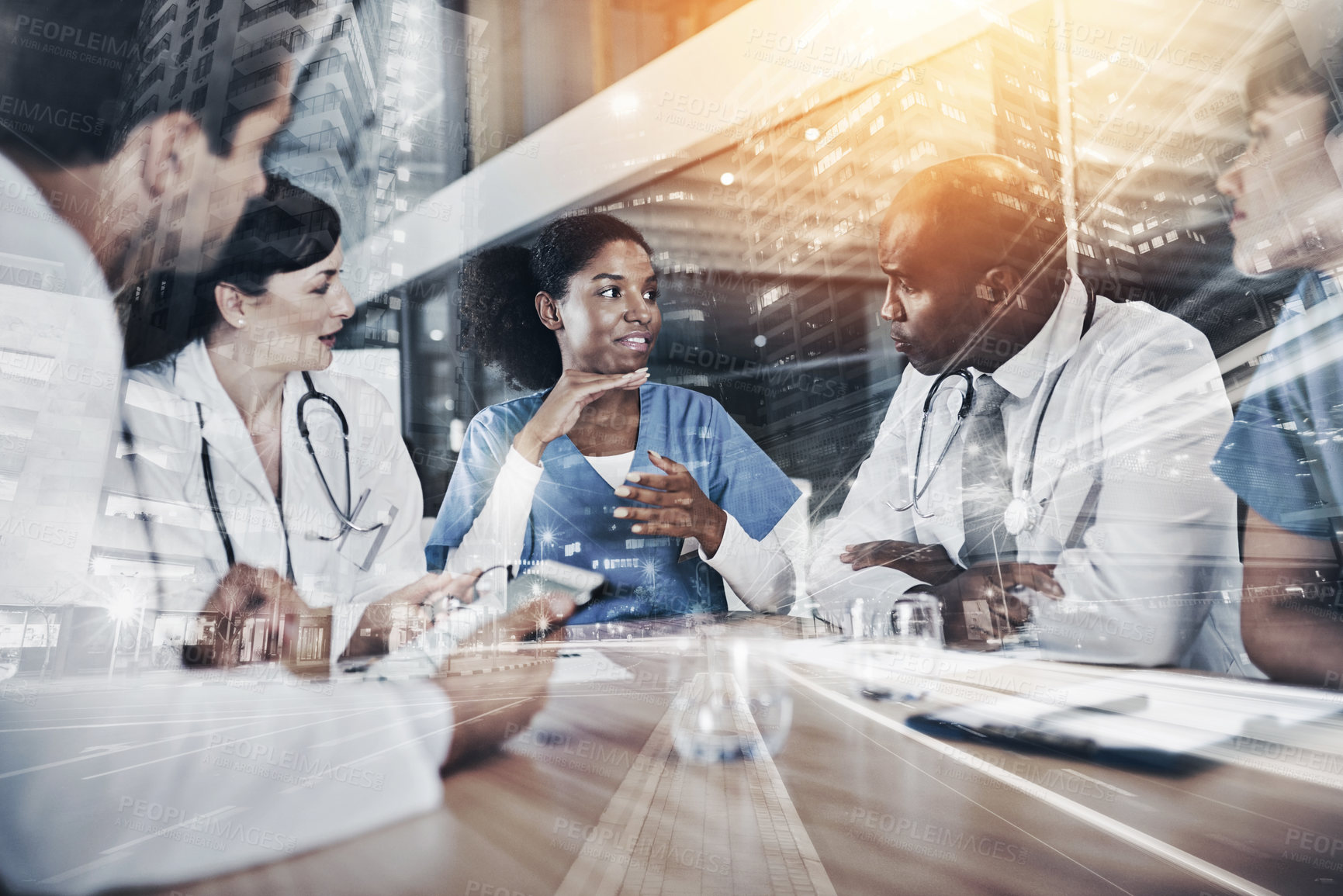 Buy stock photo Cropped shot of a group of doctors having a meeting in a hospital