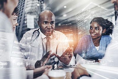 Buy stock photo Cropped shot of a group of doctors having a meeting in a hospital