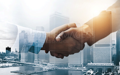 Buy stock photo Closeup shot of two unrecognizable businesspeople shaking hands in an office