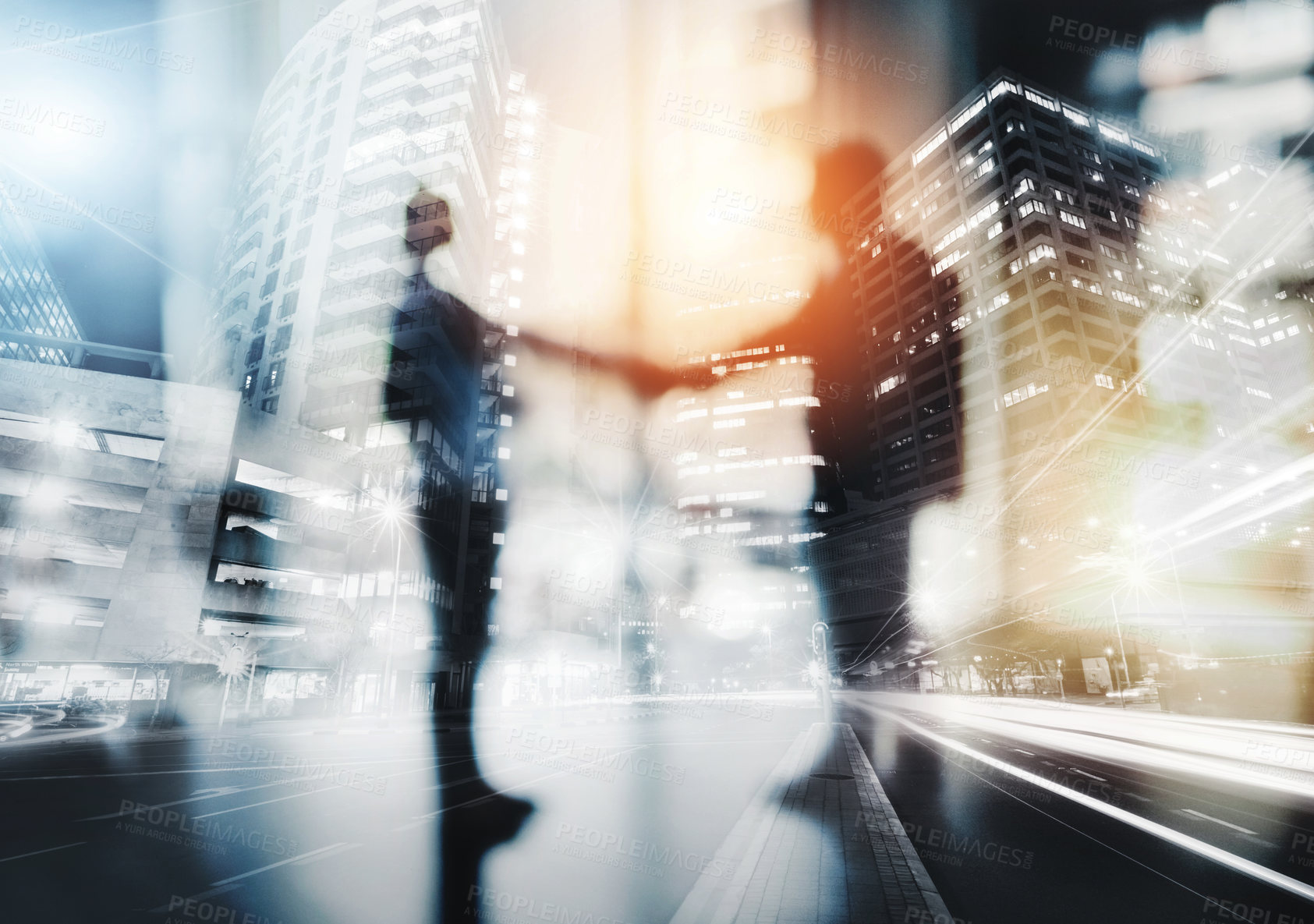 Buy stock photo Defocused shot of two businesspeople shaking hands in an office