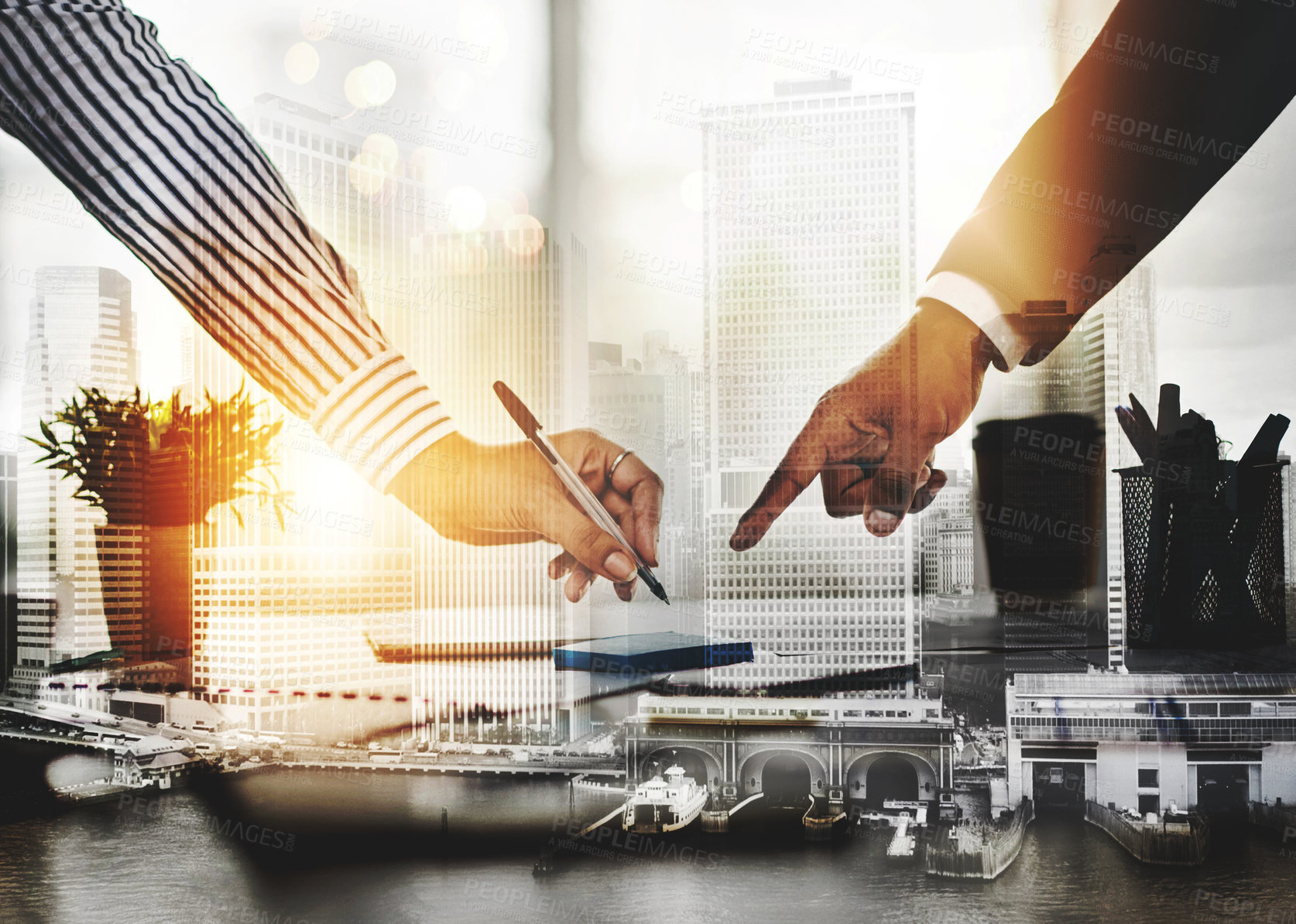 Buy stock photo Closeup shot of two unrecognizable businesspeople going through paperwork in an office