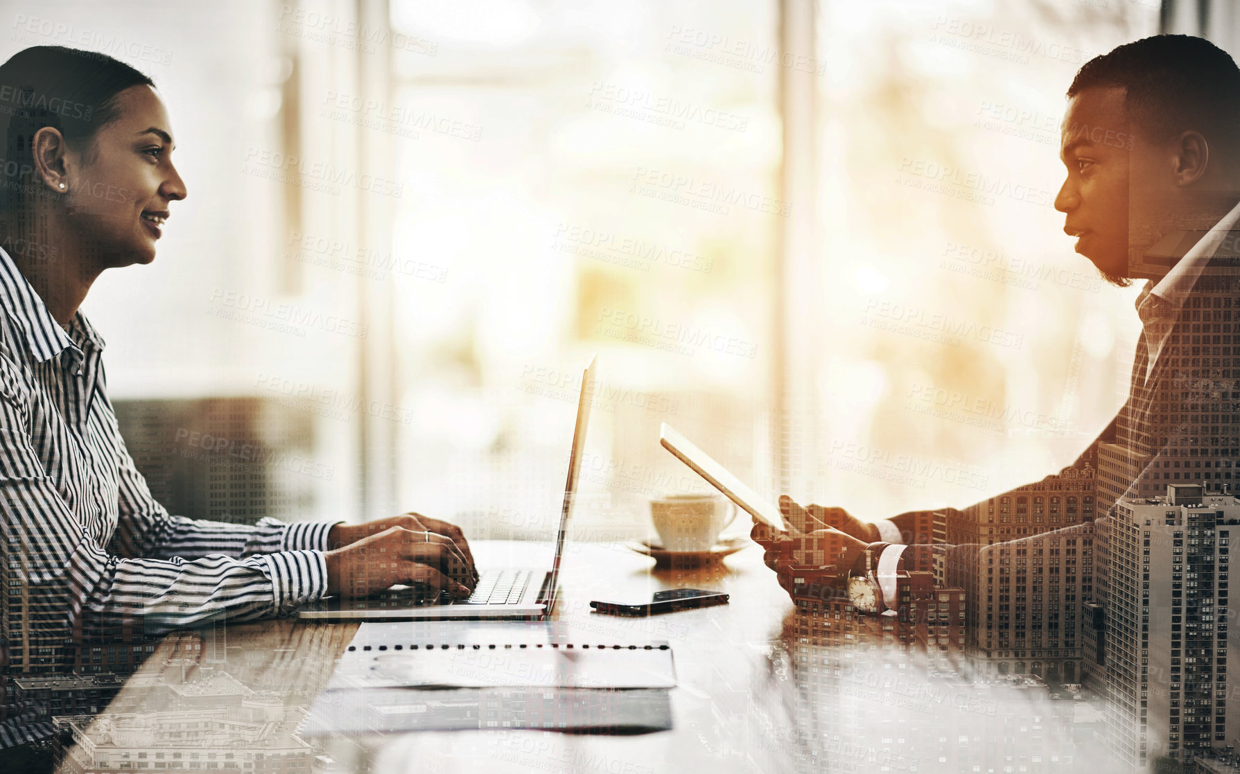 Buy stock photo Cropped shot of two businesspeople using digital devices during a meeting in an office