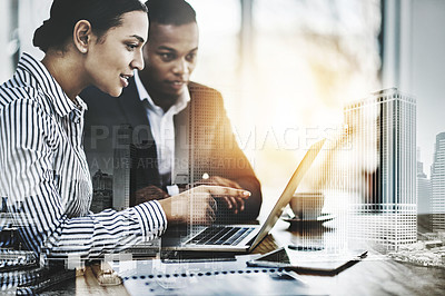 Buy stock photo Cropped shot of two businesspeople working together on a laptop in an office