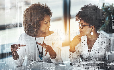 Buy stock photo Cropped shot of two young female designers working in a modern office