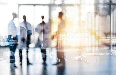 Buy stock photo Blurred shot of a team of doctors standing together in a hospital