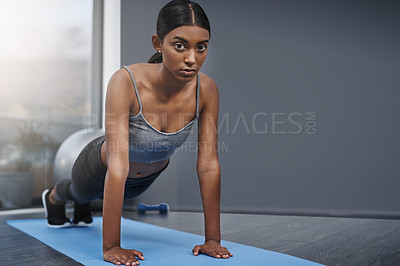 Buy stock photo Push ups, serious and portrait of woman fitness in the gym training, exercise or workout for health and wellness. Yoga, sports and healthy female person stretching for morning sport performance