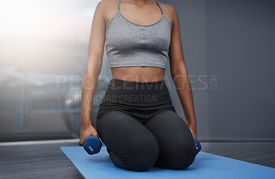 Buy stock photo Fitness, girl and dumbbells in home for exercise, yoga and workout on mat in apartment. Female athlete, pilates and training for health, wellness and muscle strength or arms with endurance in sports