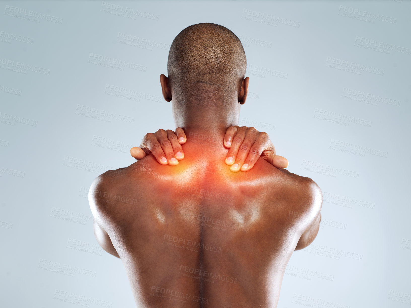 Buy stock photo Rearview shot of an unrecognizable athletic young man with cgi highlighting his injury against a grey background
