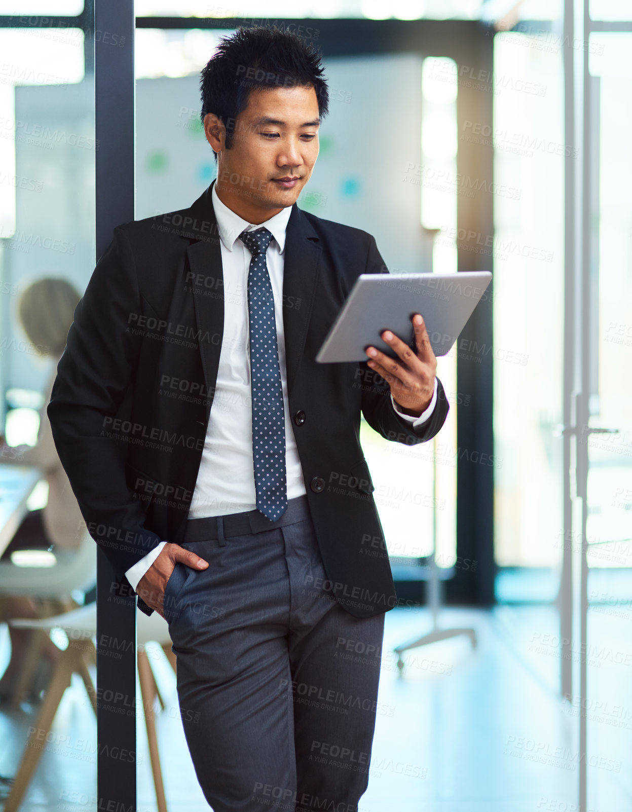 Buy stock photo Businessman, tablet and reading in office for news, information and preparation for presentation. Speaker, technology and article at window for update, new ideas or economy report for company growth