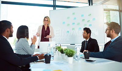 Buy stock photo Shot of corporate businesspeople having a meeting in the boardroom at work