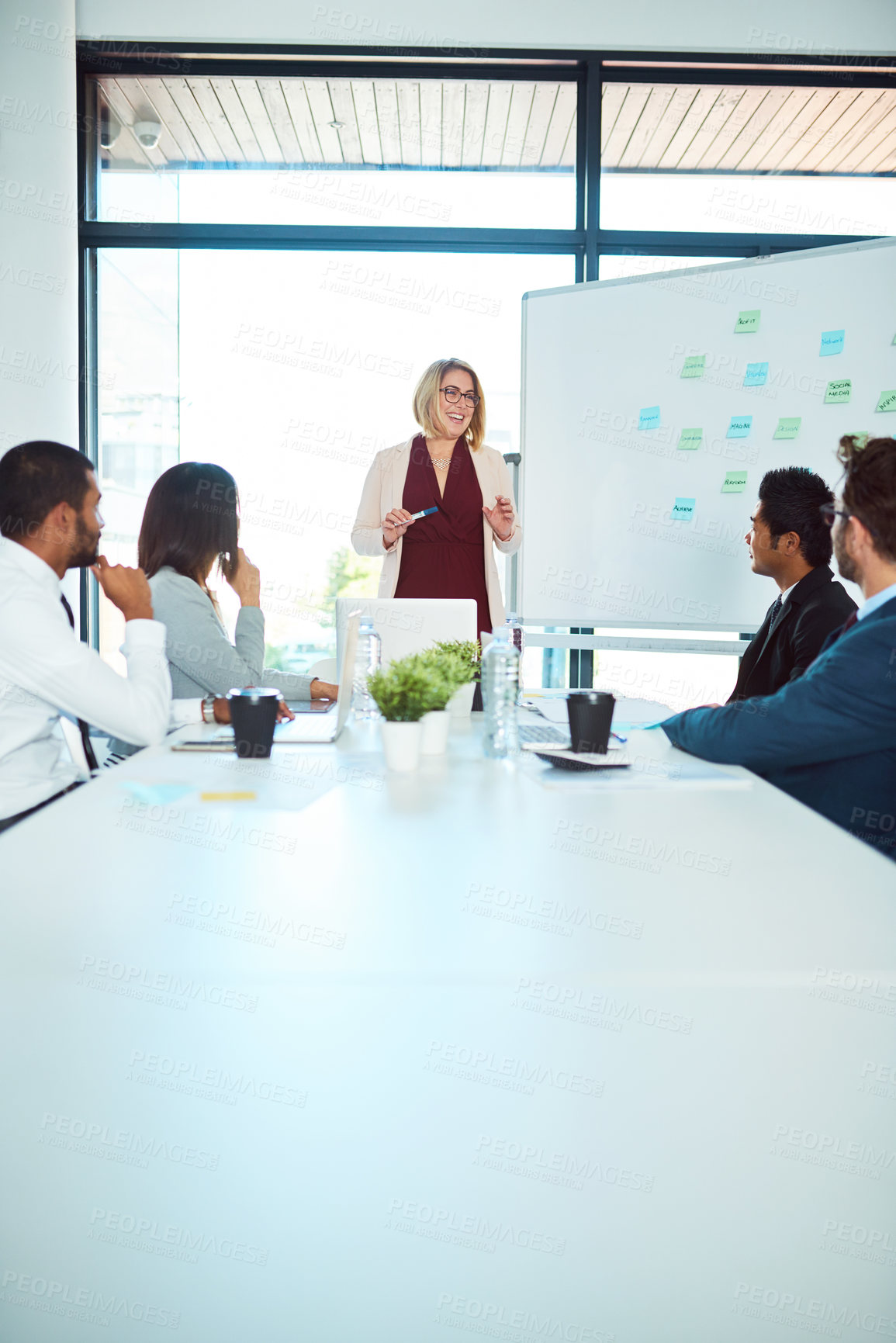 Buy stock photo Shot of corporate businesspeople having a meeting in the boardroom at work