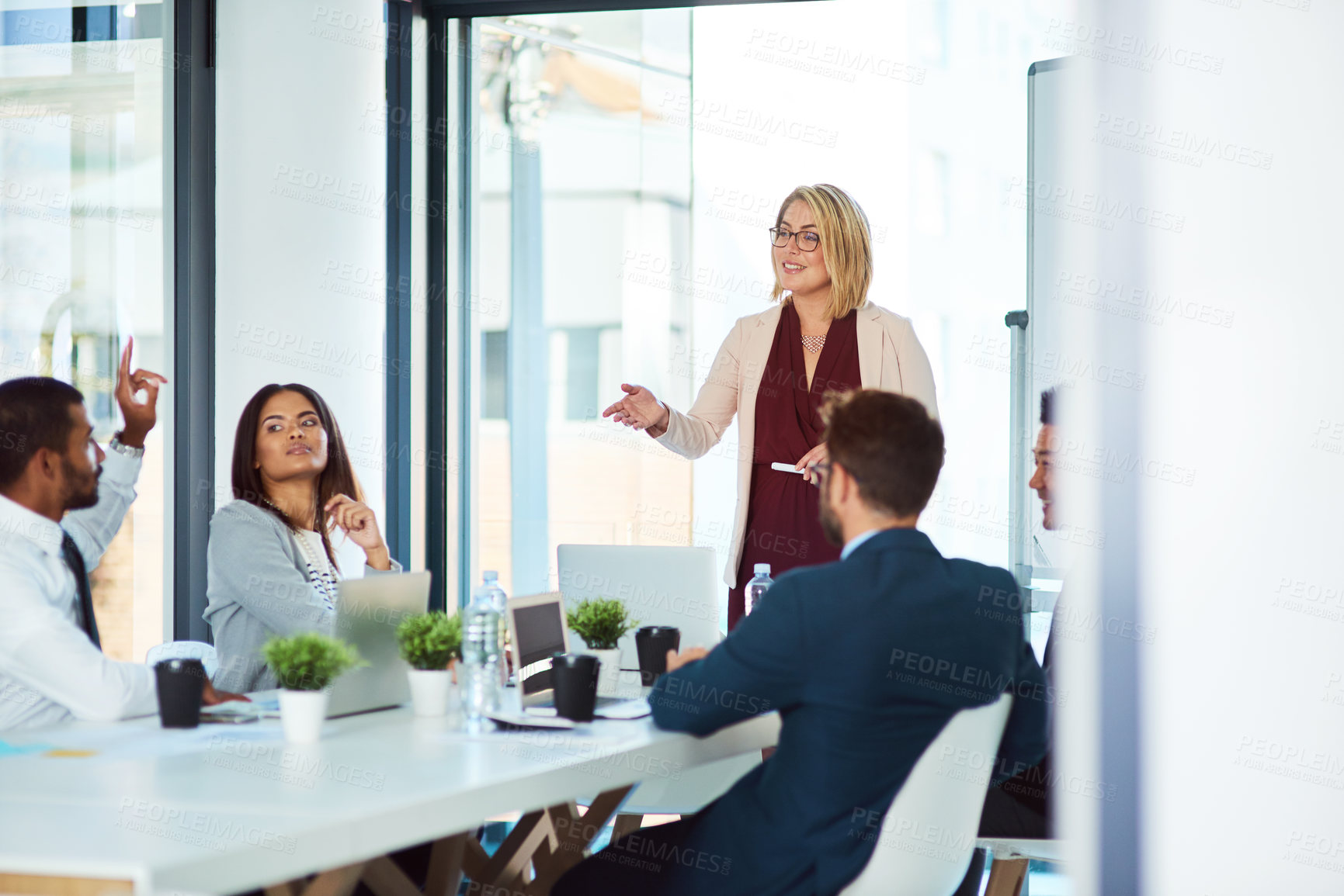 Buy stock photo Shot of corporate businesspeople having a meeting in the boardroom at work