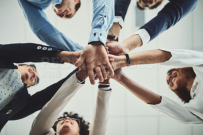 Buy stock photo Hands together, business people and solidarity with low angle, support and team huddle with collaboration. Group of employees working in office, teamwork and mission with workforce and hand stack