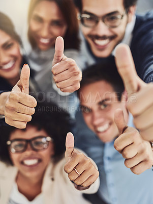 Buy stock photo Thumbs up from a happy business team excited about the success they achieve together at work. Overhead view diverse group of corporate people excited by success and give approval to winning