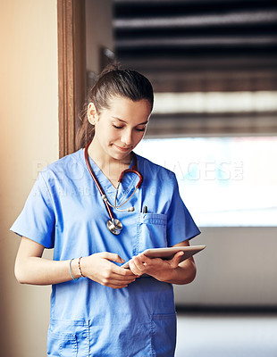 Buy stock photo Telehealth, nurse and woman with tablet for reading email, healthcare report or research in clinic. Scroll, medical surgeon and digital technology for hospital results, service and information online