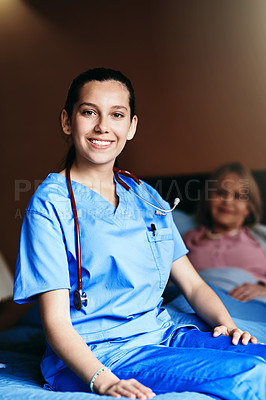 Buy stock photo Shot of a female nurse working in a retirement home
