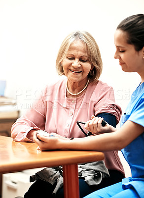 Buy stock photo Blood pressure, nurse and senior woman in home for healthcare test at cardiovascular consultation. Hypertension, medical and caregiver check pulse of elderly patient with heart rate machine in house.