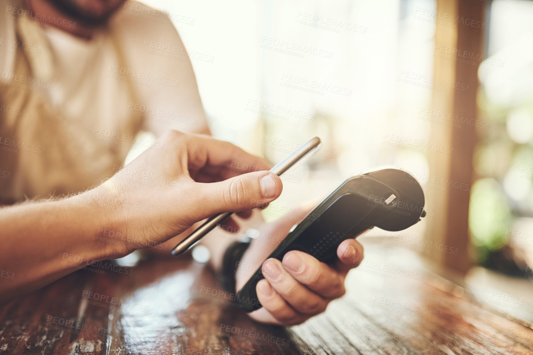 Buy stock photo Hand, cellphone and pos terminal in coffee shop for payment by customer for waitress service. Finance, bill and nfc with person paying paperless using wireless technology in  cafe or restaurant