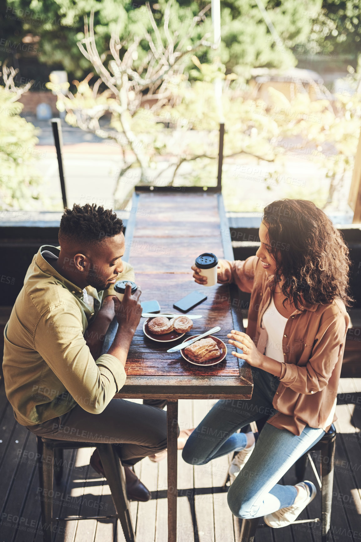 Buy stock photo Couple, relax and coffee with food at restaurant for romantic date, conversation and nutrition together. Man, woman and smile in love with drink at cafe for breakfast, bonding and beverage in morning