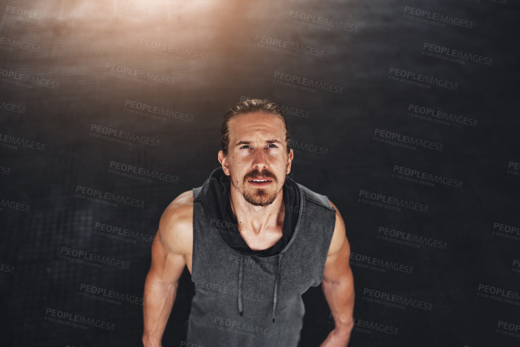 Buy stock photo High angle shot of man exercising in a gym