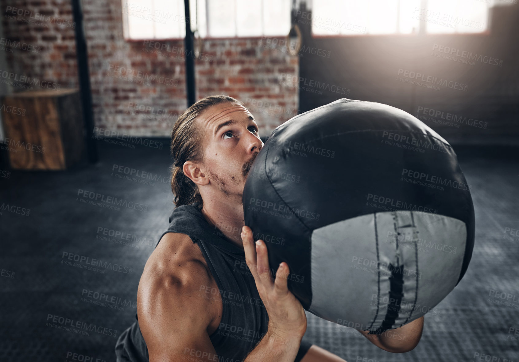 Buy stock photo Fitness, exercise  and man with medicine ball in gym, healthy and workout for recovery, strong and athlete. Determined, bodybuilder and training with equipment in club, active and lifting for muscle