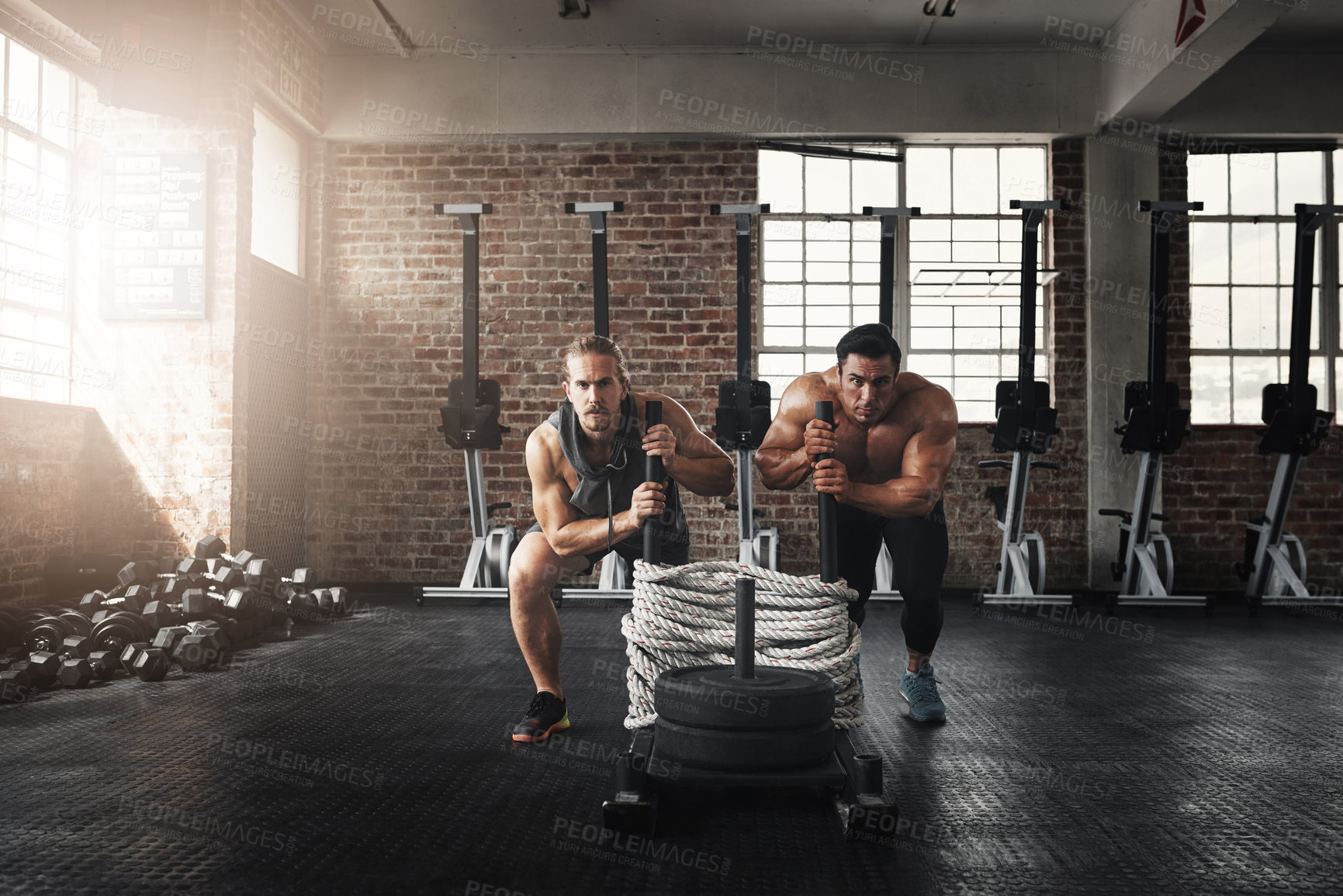 Buy stock photo Athletes, training or pushing weights in gym together for teamwork, practice or group sports. Strong, men or friends exercise in fitness centre for cardio class, physical activity and calisthenics