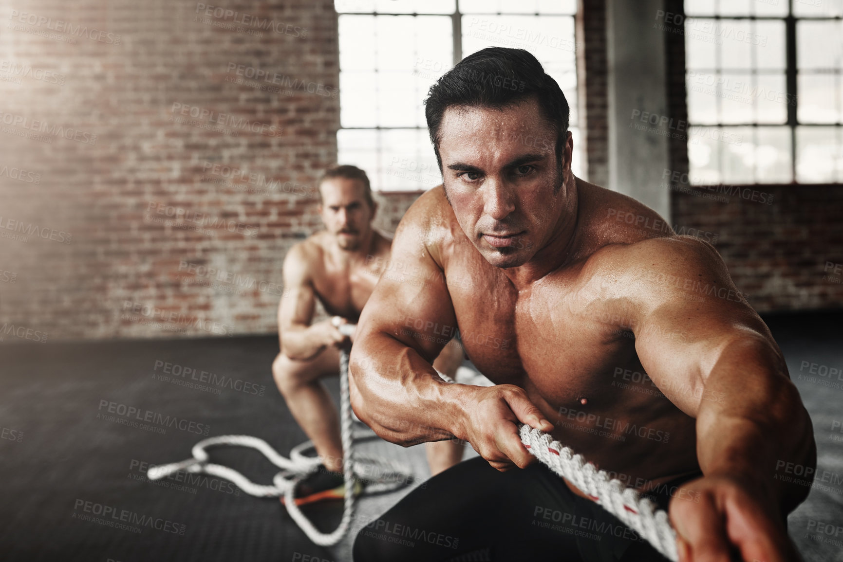 Buy stock photo Men, gym and pull rope for exercise with strong muscle, coaching or teamwork for health, self care and together. Body builder partnership, focus and tug of war for workout, health or support on floor