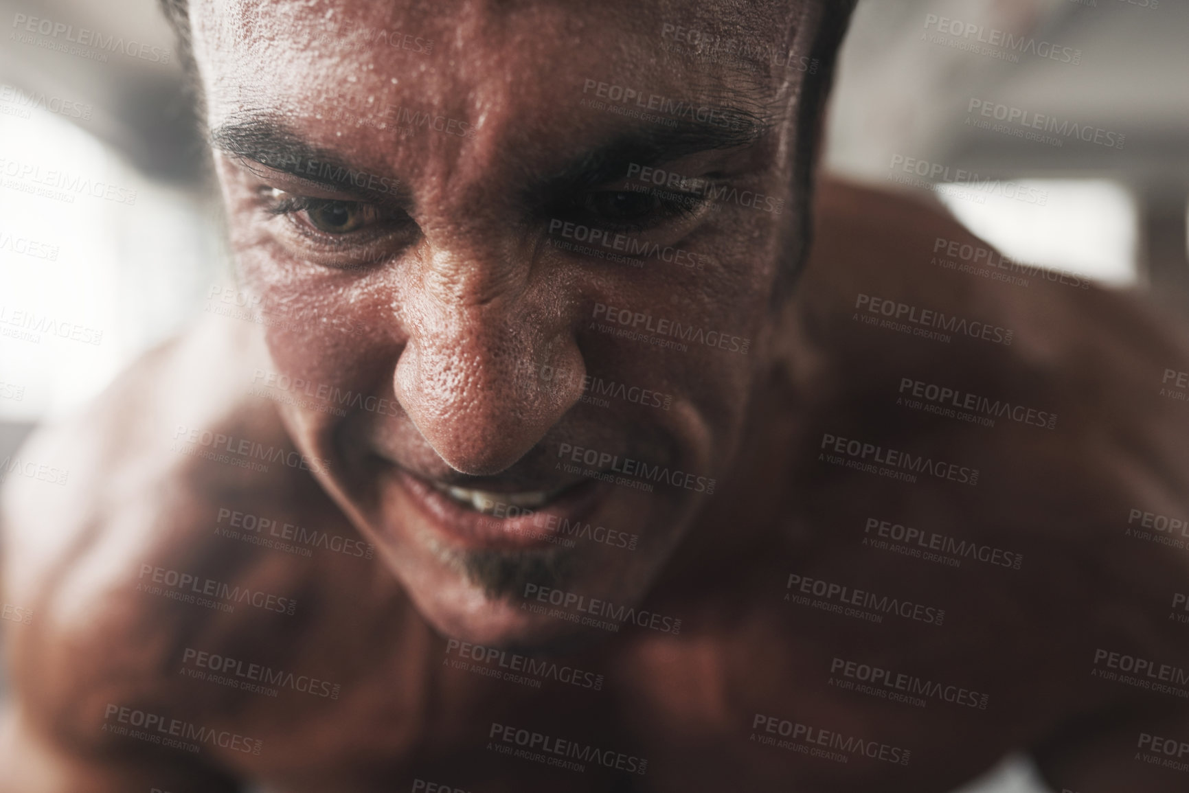 Buy stock photo Closeup, power and man in gym, face and determination of bodybuilder, training and biceps. Health club, healthy and fitness of person, workout and discipline for physical, strength and exercise