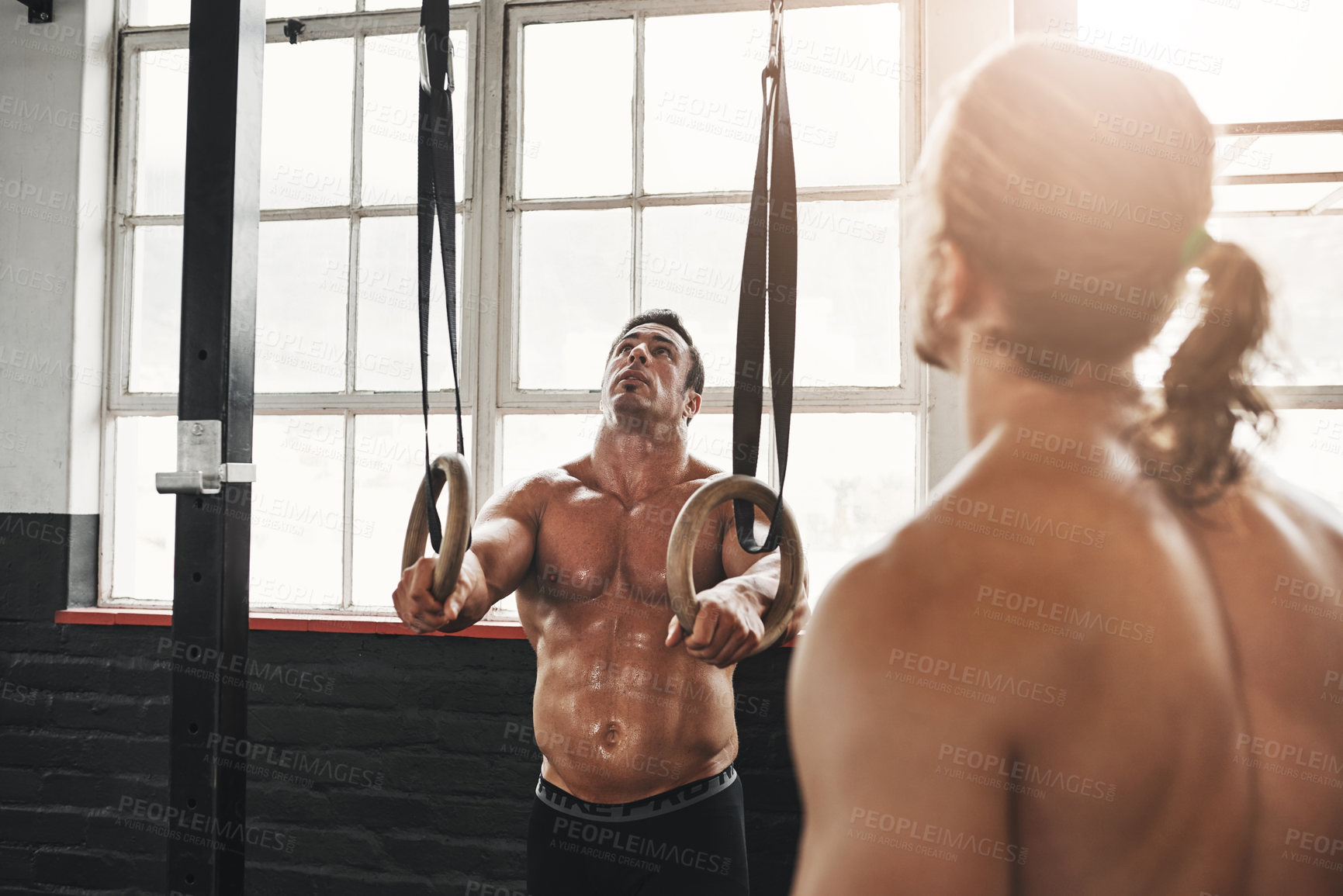 Buy stock photo Gym, instructor and gymnastic rings for man, exercise and  with client for fitness, healthy and strong. Health club, wellness and personal trainer with person for training, bodybuilding and biceps