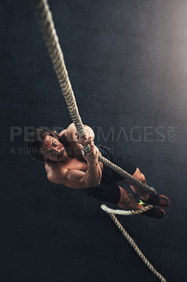 Buy stock photo Above, climbing and man with rope, fitness and endurance with challenge, wellness and workout. Person, athlete and bodybuilder with practice for sports, training and healthy with cardio in gym