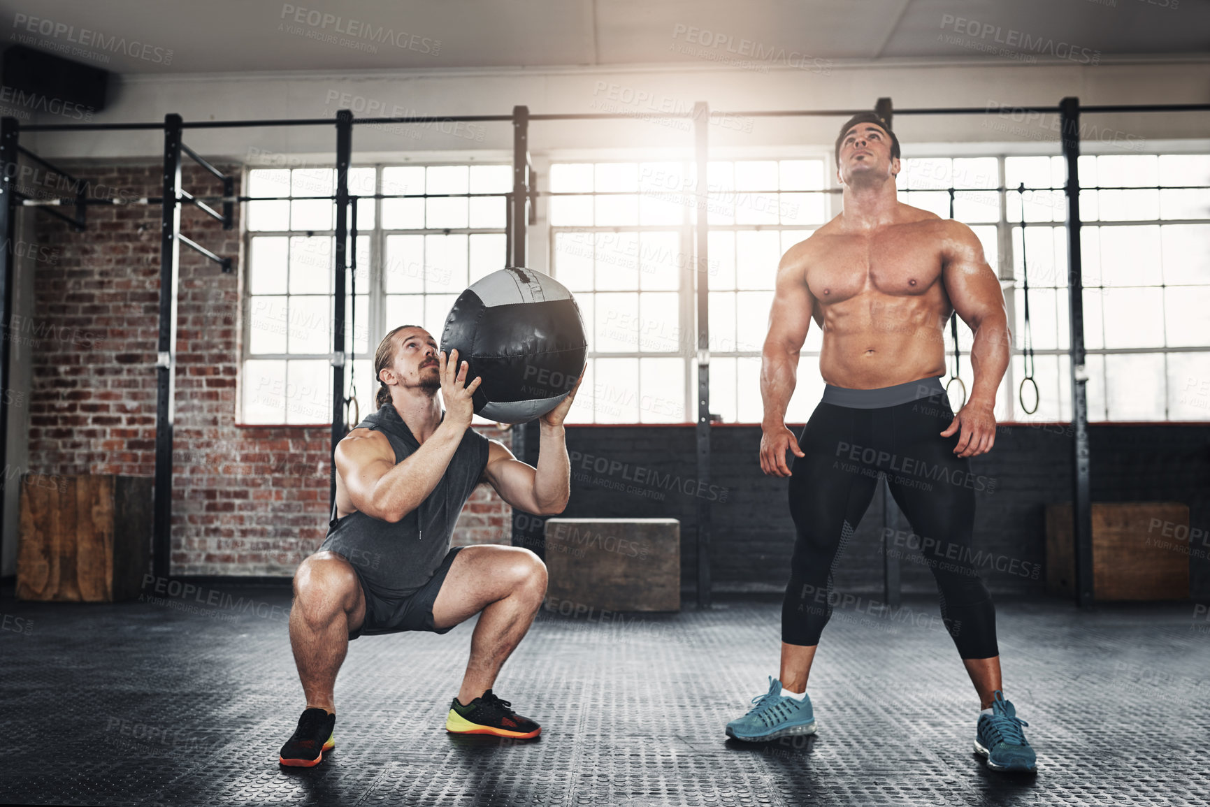 Buy stock photo Men, friends and throw medicine ball at gym for bodybuilding with strength and determination. Workout, muscles and strong as body builder on training, fitness and exercise for health and self care