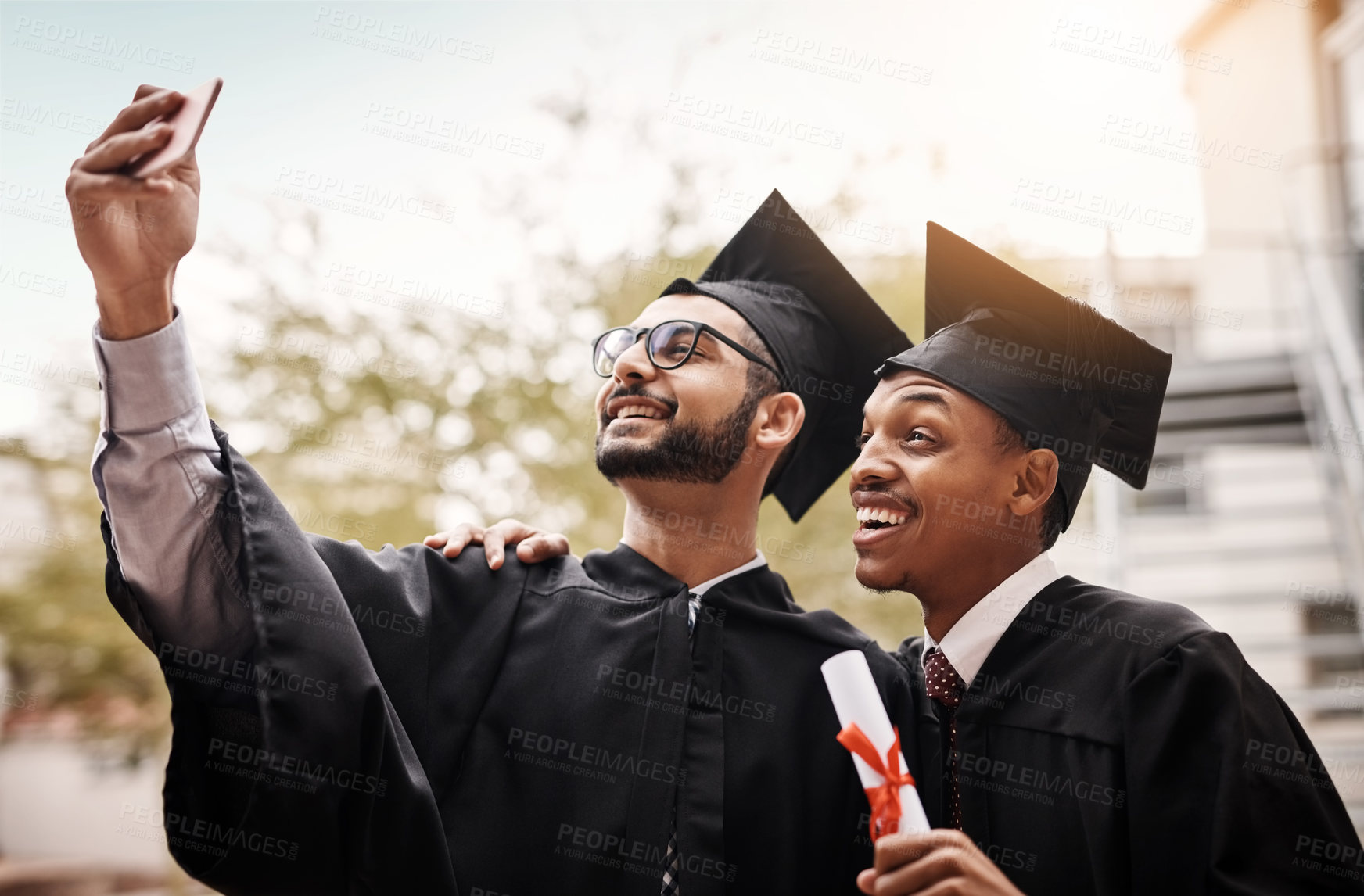 Buy stock photo Friends, graduation and selfie of a college students with a diploma and smile outdoor. Men happy to celebrate university achievement, education success and future at school event with graduate memory