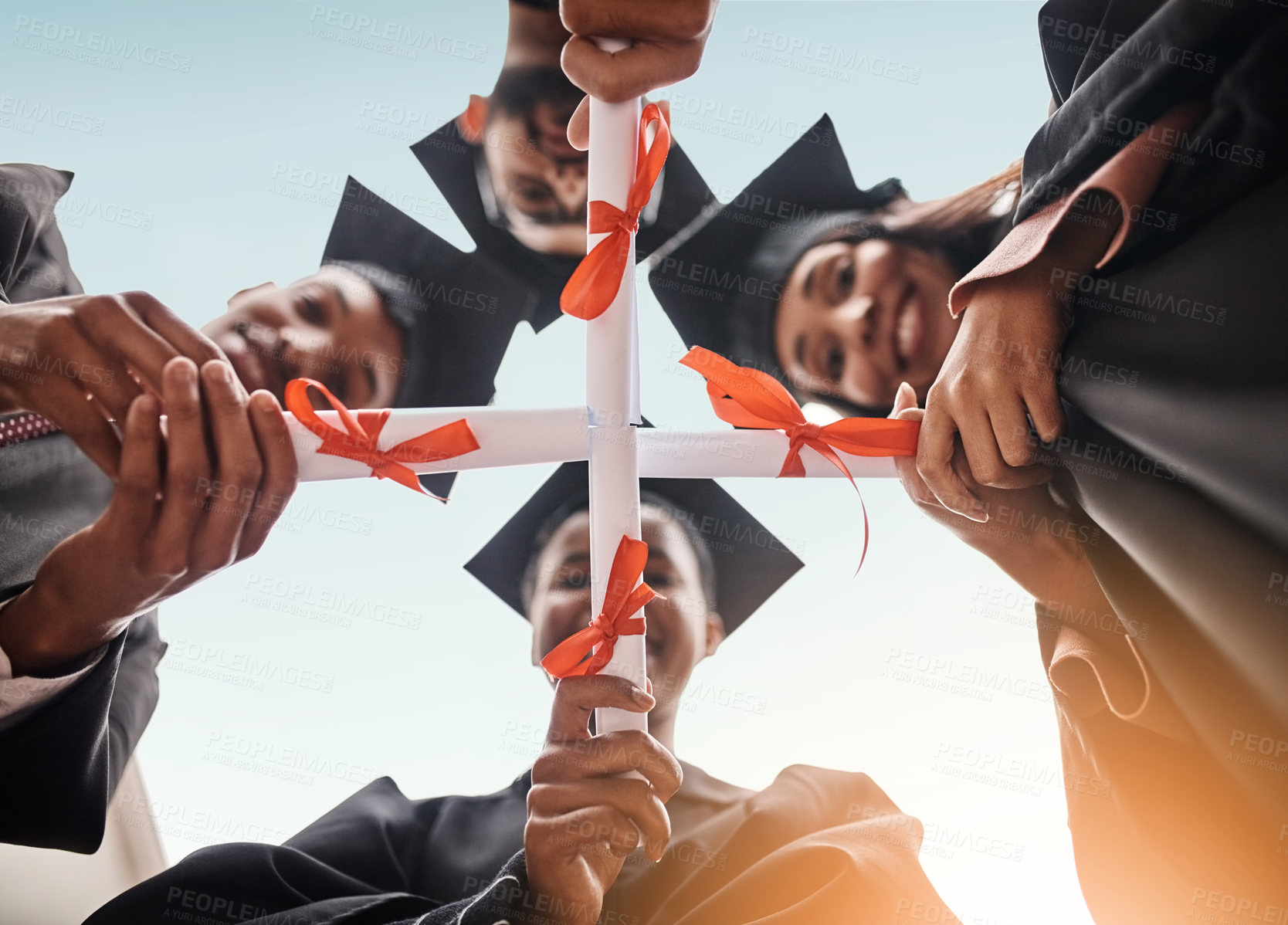 Buy stock photo Students, graduation and diploma in hands of college group outdoor to celebrate. Below diversity men and women happy for university achievement, education success and future at school graduate event