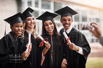 Buy stock photo Students, graduation and diploma of a college group with a smile and pride outdoor. Diversity men and women excited to celebrate university achievement, education success and graduate memory or photo