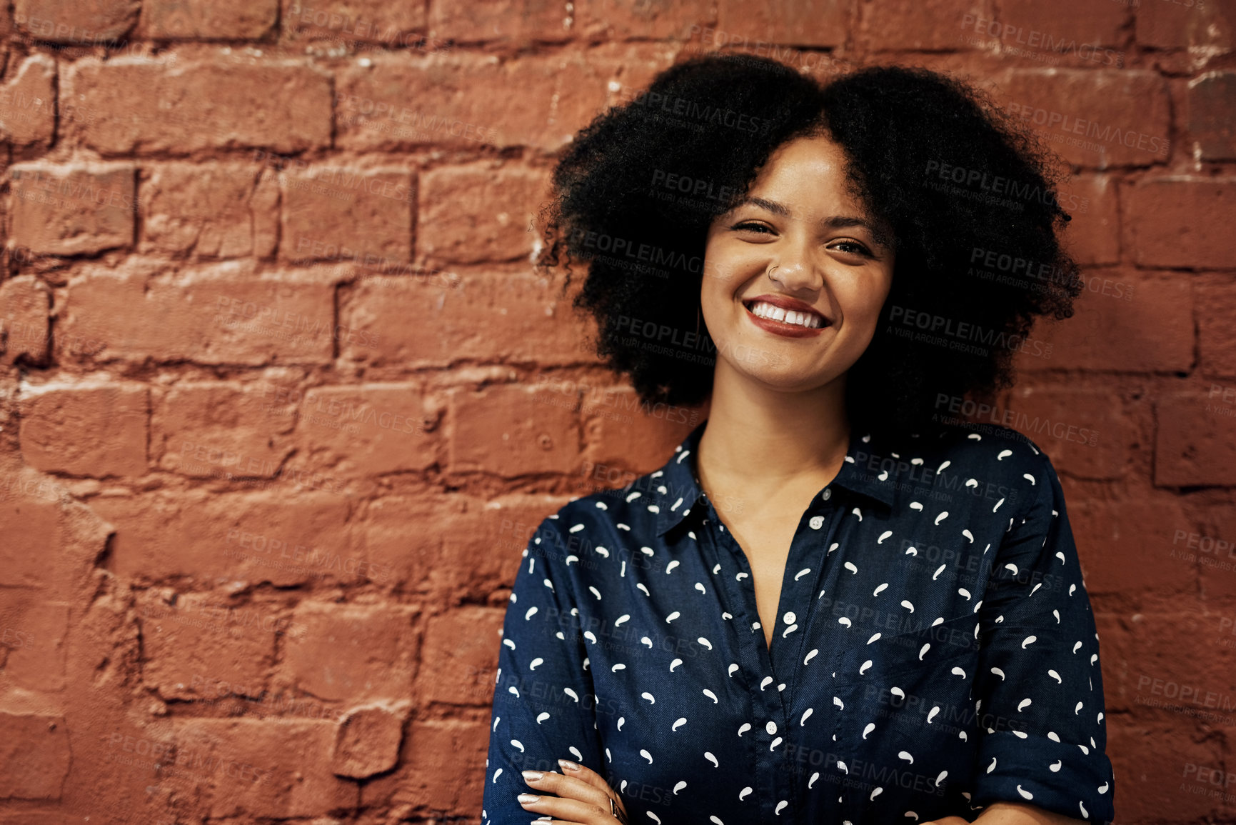 Buy stock photo Portrait, happy and business woman on brick wall space for career or job at creative startup company. Face, entrepreneur and smile of confident professional employee, worker and copywriter in Brazil