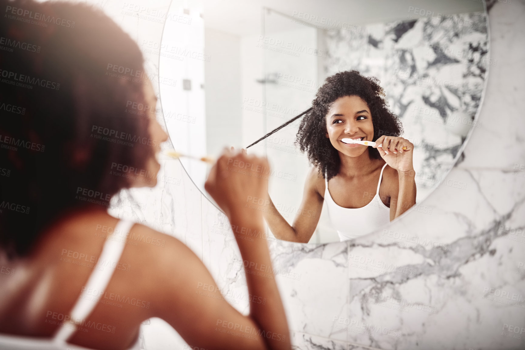 Buy stock photo Happy, woman and reflection with brushing teeth in bathroom for dental care, cleaning and grooming. Home, person and toothbrush with hair check in mirror for oral hygiene, routine and fresh breath