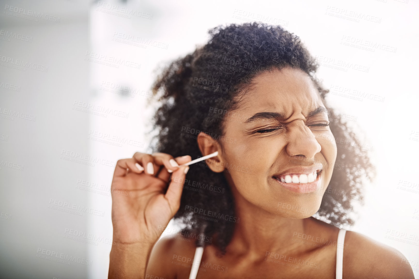 Buy stock photo Scared, woman and cotton bud for hygiene with eyes closed for self care and cleaning. African person, home and removing earwax for germs, dirt and bacteria for wellness, routine and grooming